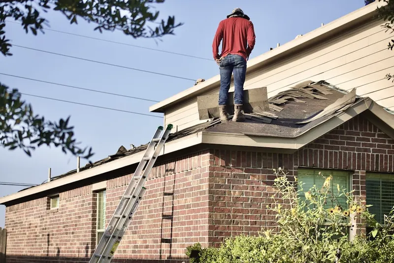 Professional roofer working on a residential roof in Double Diamond